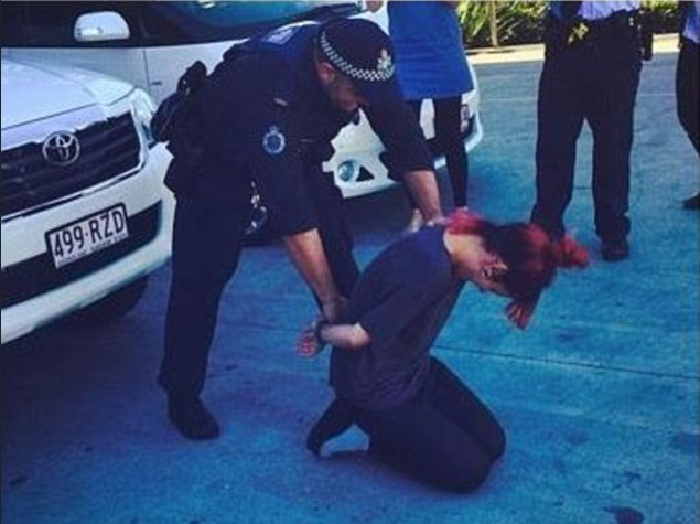 Lily Allen handcuffed by Australian police at Gold Coast airport of the way to Byron Bay music festival 28 July 2014