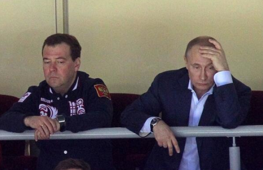 Putin watching Russian lose to Finland with Medvedev