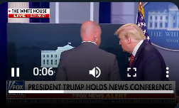 Trump was taken out of the room shortly after the press conference began. 